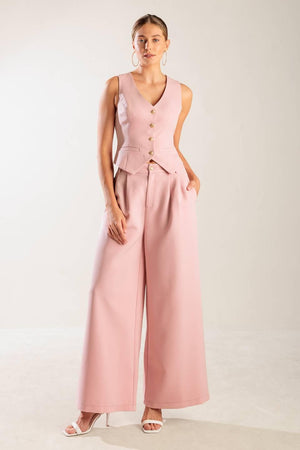 A solid woven pant featuring front closure, side pockets, and wide leg.