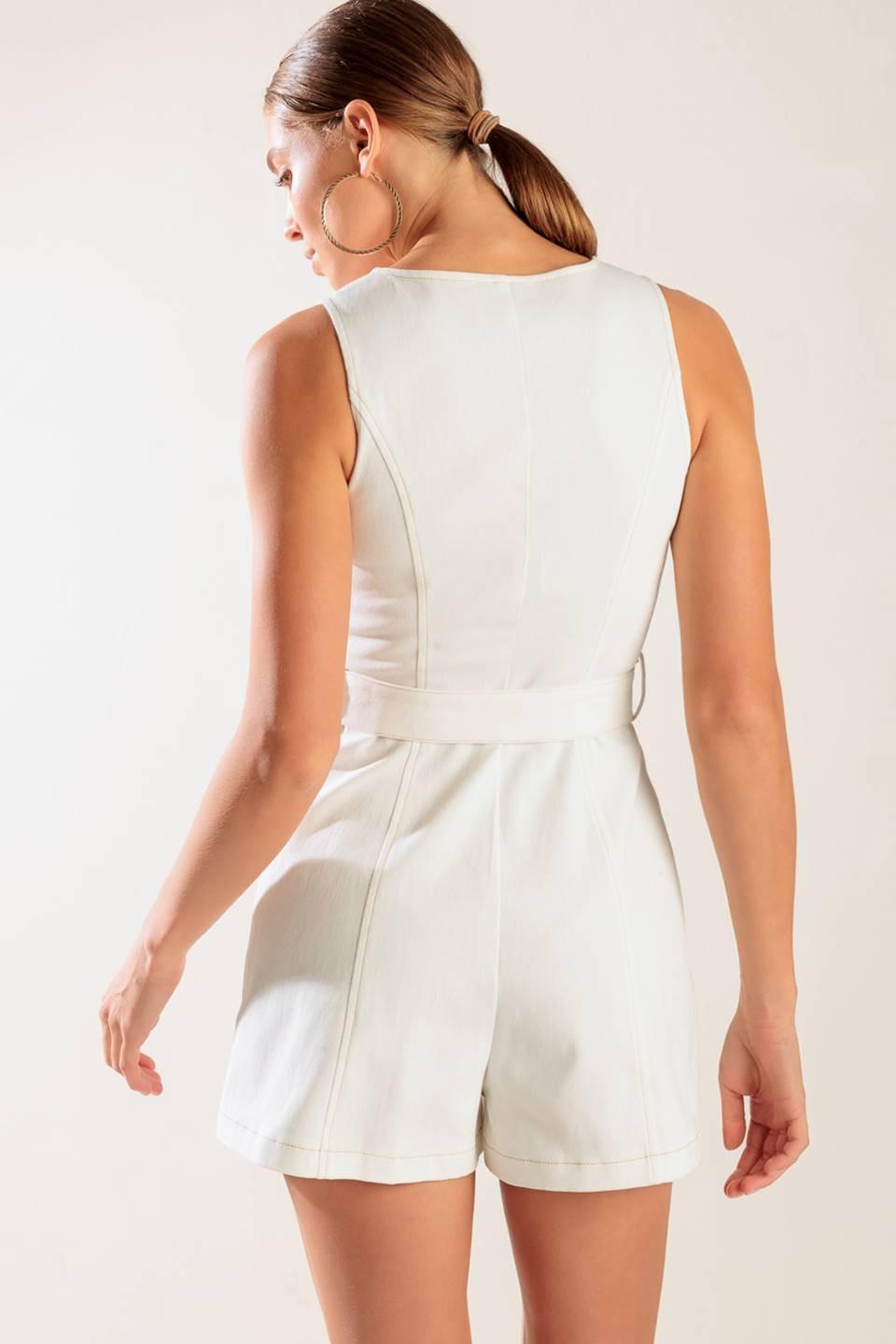 A solid white woven romper featuring V neckline, sleeveless, button down closure and self belt
