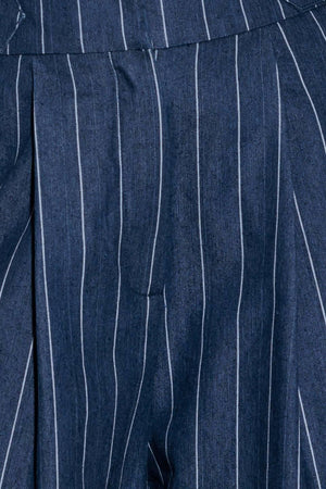 A striped woven pant featuring front closure, side tab, pockets and wide leg.
