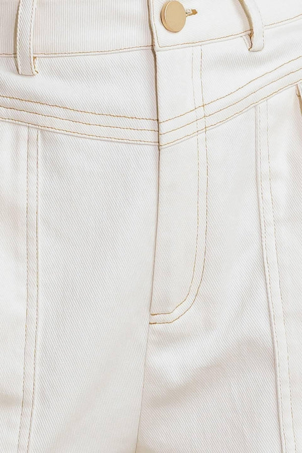 A solid woven short featuring front closure and side back pockets