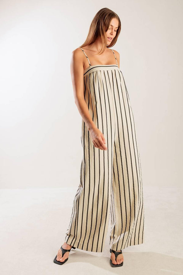 JUST THE BEGINNING WOVEN JUMPSUIT.