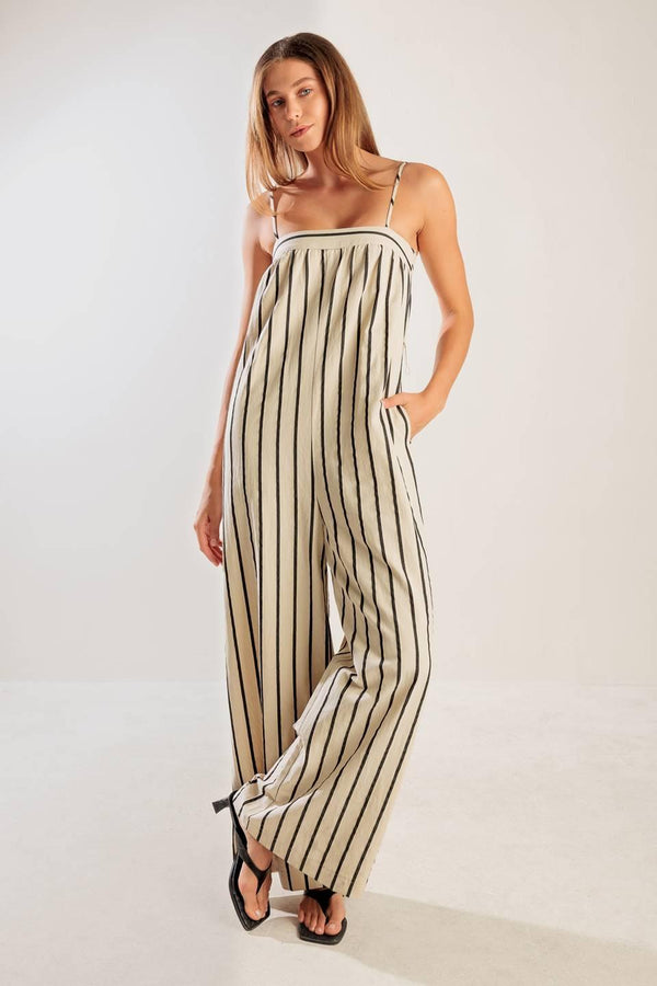 JUST THE BEGINNING WOVEN JUMPSUIT.