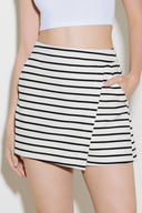A striped woven skort with side zipper closure.