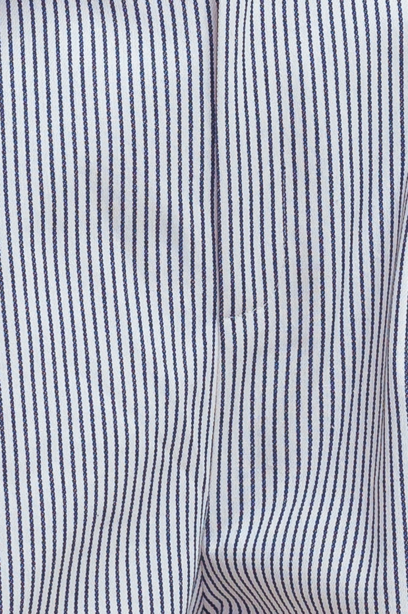 A striped woven pant featuring front closure, pockets and wide leg.
