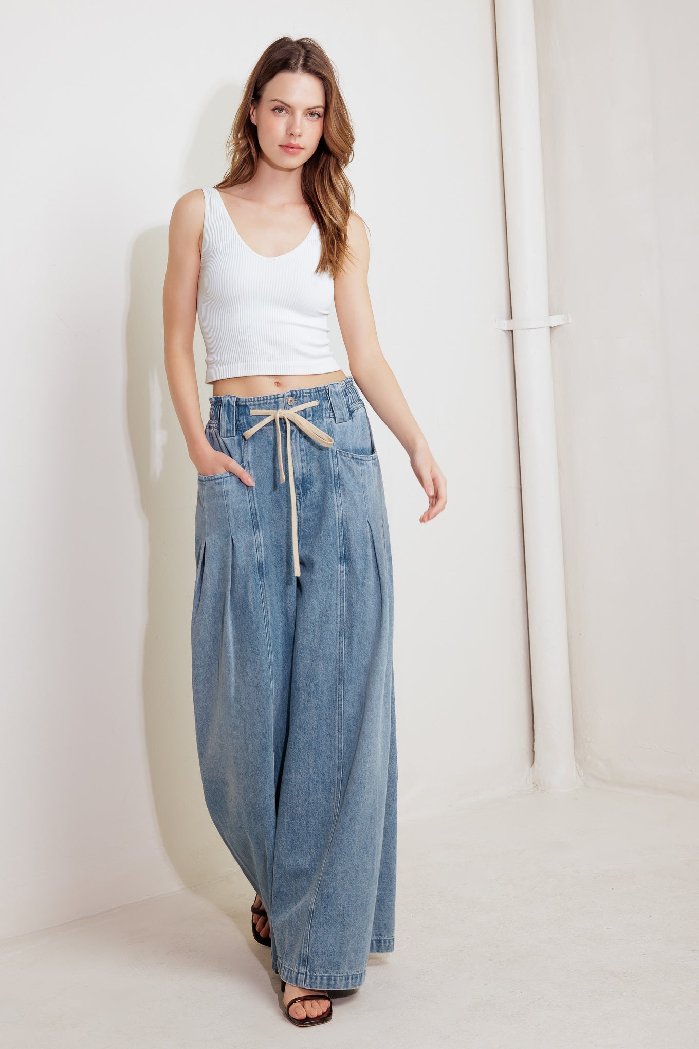 A washed denim pant featuring front closure, elasticized waist with contrasting tie, side pocket and wide leg

Details:

Self : 85% Cotton 15% Polyester

Size &amp; Fit

- Model is 5`8" And Wearing Size Small
- Measurements Taken From Size Small
- Approx. Length: 45" Flying Tomato