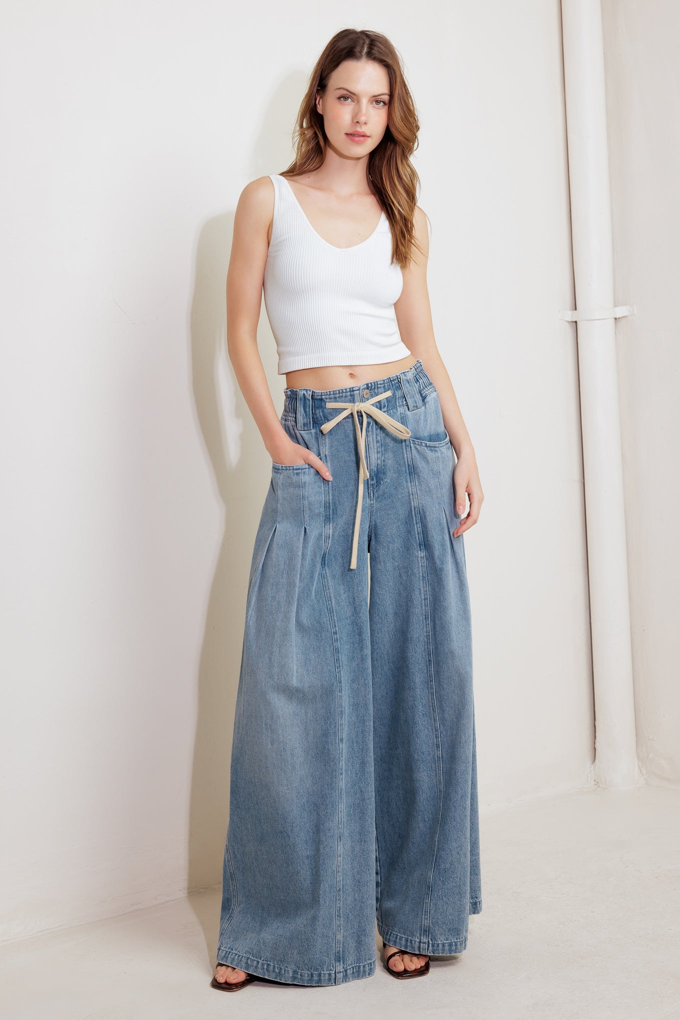 A washed denim pant featuring front closure, elasticized waist with contrasting tie, side pocket and wide leg

Details:

Self : 85% Cotton 15% Polyester

Size &amp; Fit

- Model is 5`8" And Wearing Size Small
- Measurements Taken From Size Small
- Approx. Length: 45" Flying Tomato