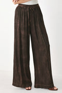 A woman wearing dark brown wide-leg drawstring pants with a mottled or washed texture | FREEMARKET