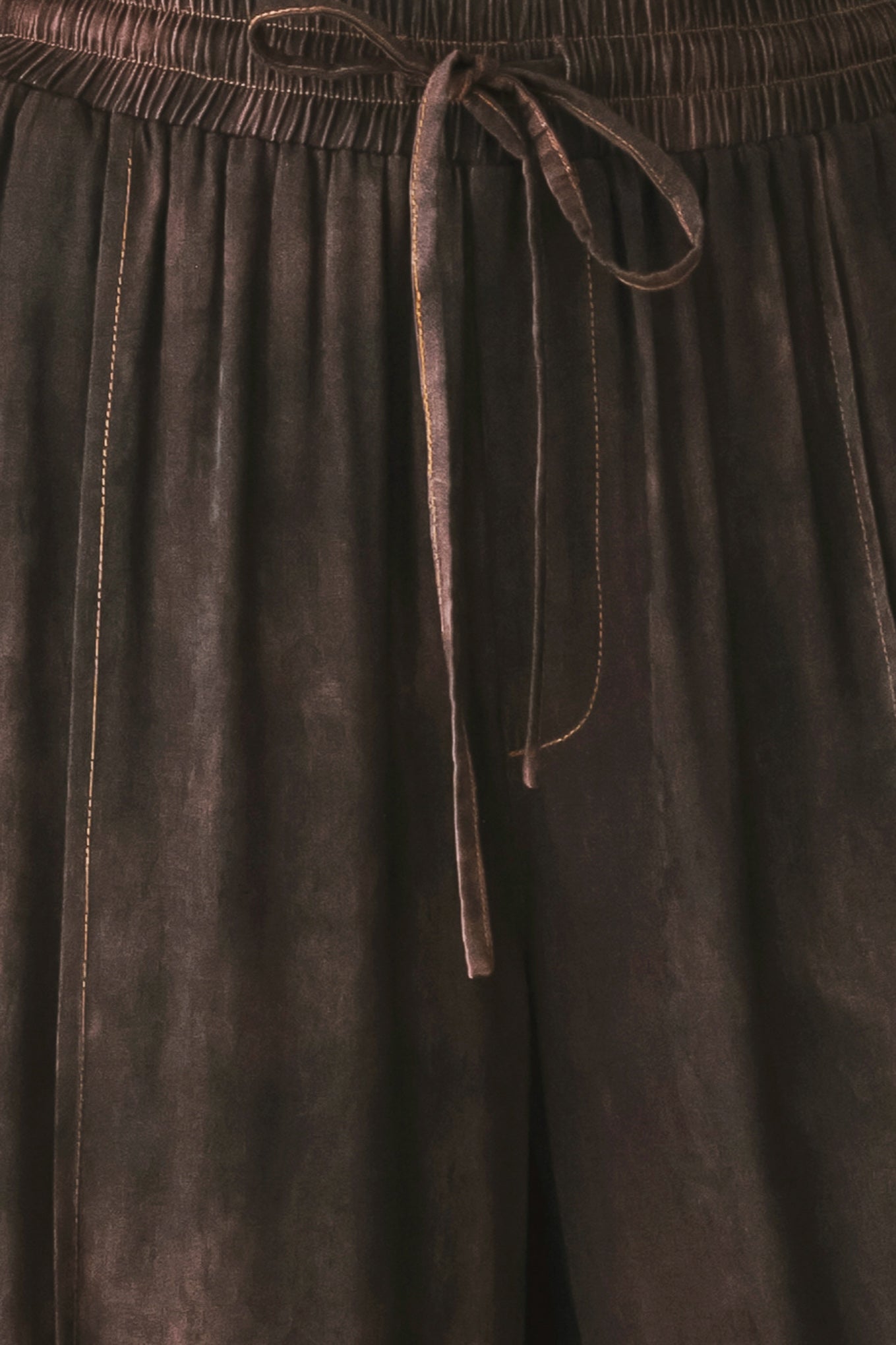 A woman wearing dark brown wide-leg drawstring pants with a mottled or washed texture | FREEMARKET