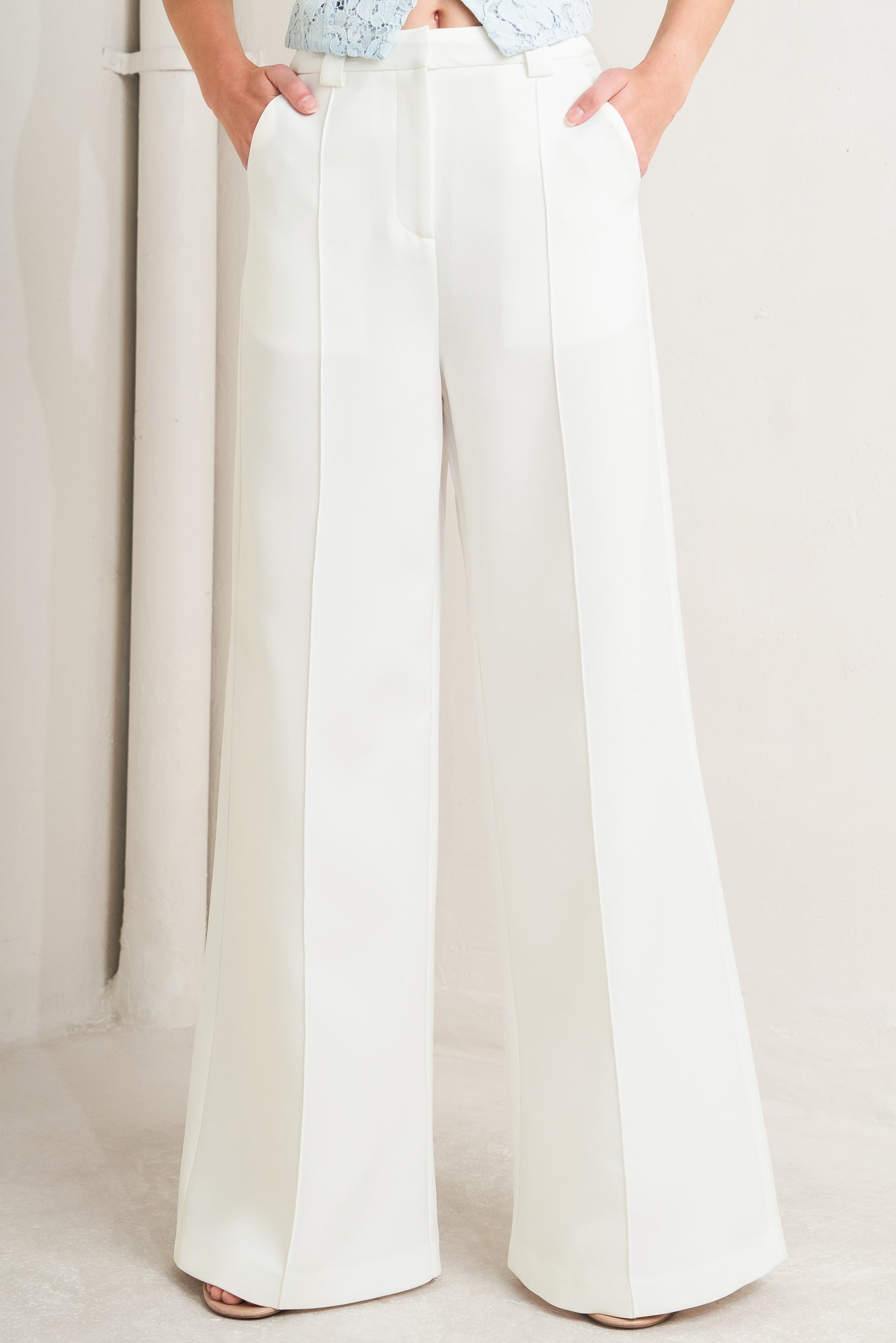 A solid woven pant with front closure, side pockets and wide leg

Details:

Self : 100% Polyester

Size & Fit

- Model is 5`8" And Wearing Size Small
- Measurements Taken From Size Small
- Approx. Length: 45"