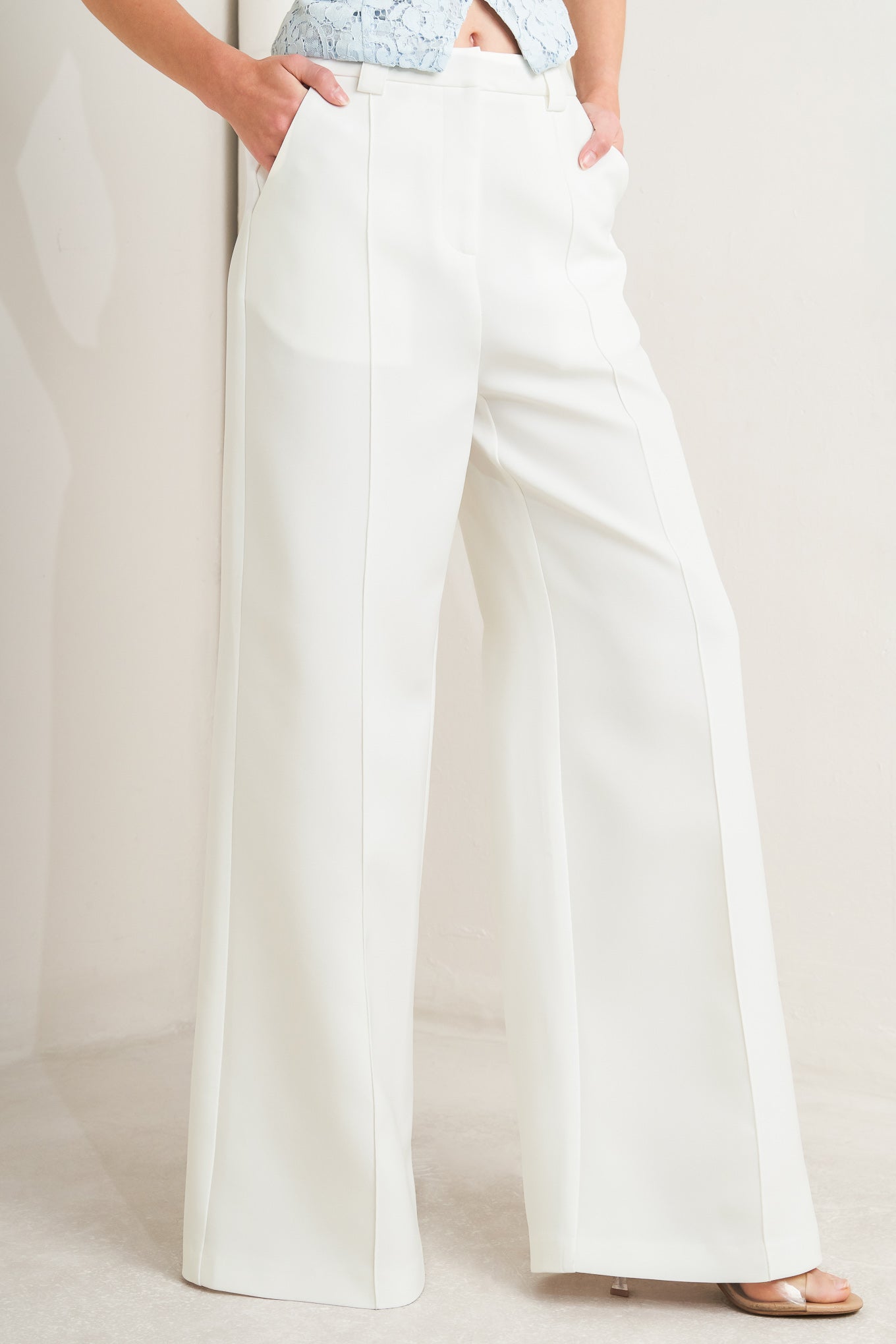 A solid woven pant with front closure, side pockets and wide leg

Details:

Self : 100% Polyester

Size & Fit

- Model is 5`8" And Wearing Size Small
- Measurements Taken From Size Small
- Approx. Length: 45"