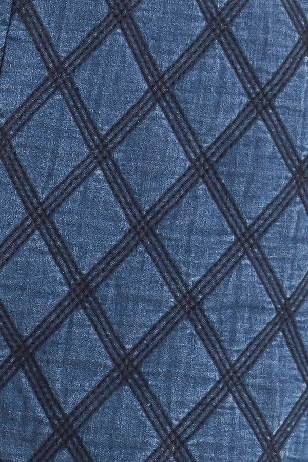 A quilted woven short featuring side pocket with button detail and back zipper closure.