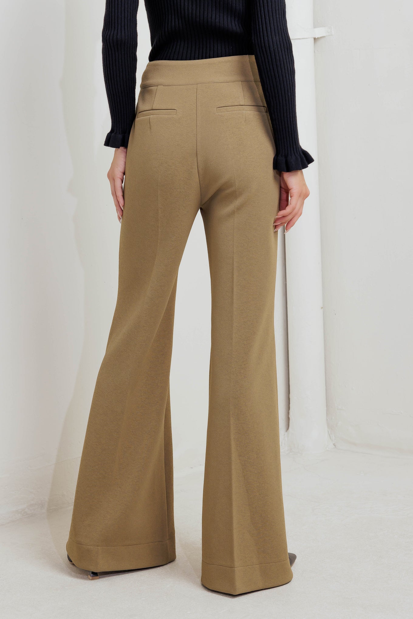A knit pant featuring front closure and wide leg. Matching vest FJ1304