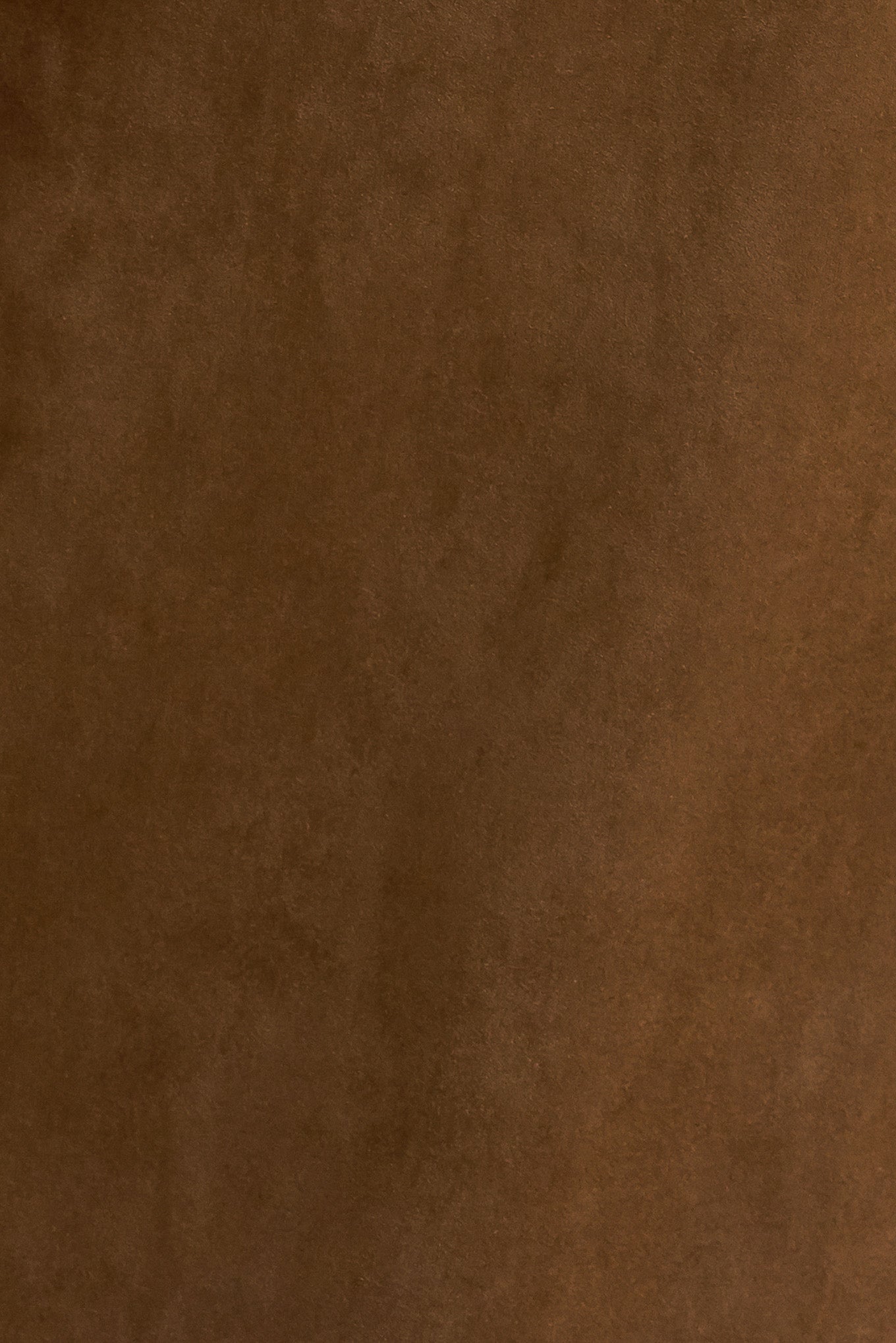 A faux suede pant featuring side and back pocket, front closure and flare leg.