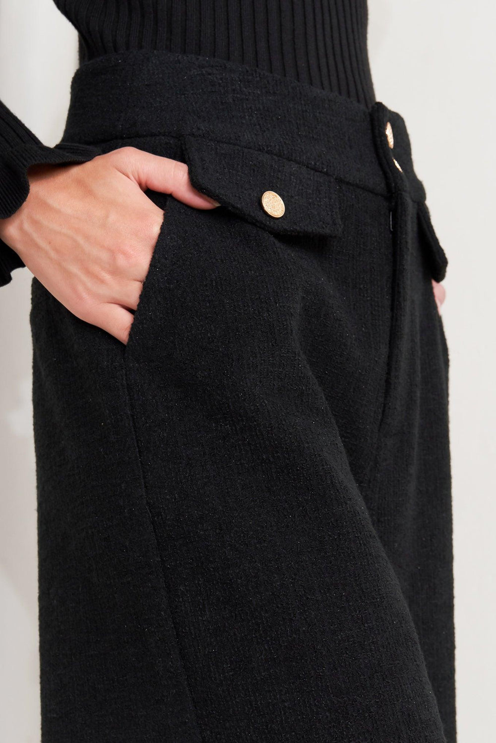 A woven pant with front closure and wide leg.
