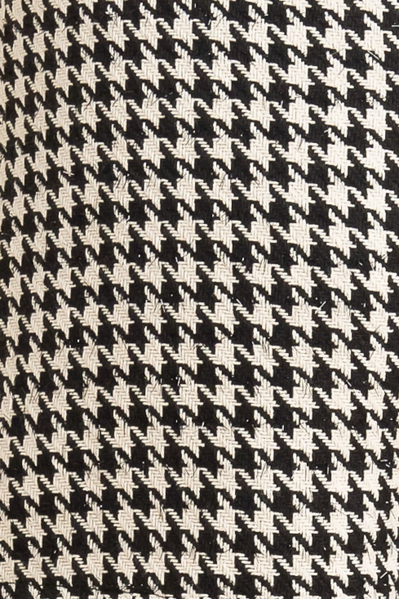 A woven skort featuring PU contrast, button down detail and back zipper closure