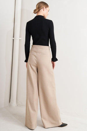 A solid knit pant with front closure and wide leg