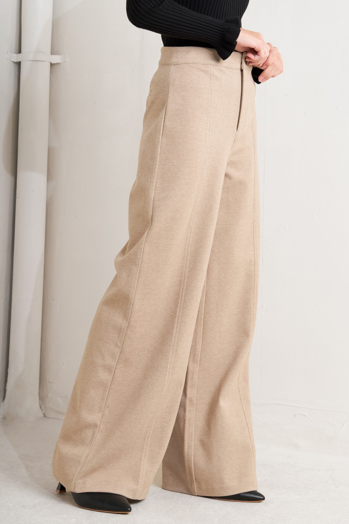 A solid knit pant with front closure and wide leg