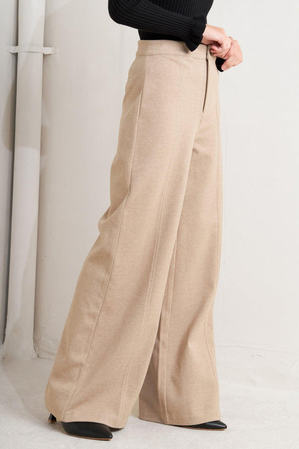 A solid knit pant with front closure and wide leg