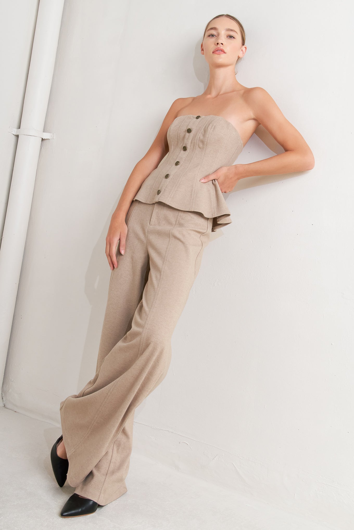 A solid knit pant with front closure and wide leg