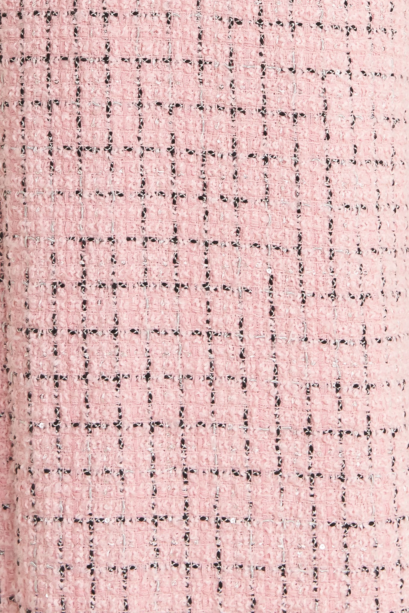 A tweed pant featuring front closure, pockets and wide leg.