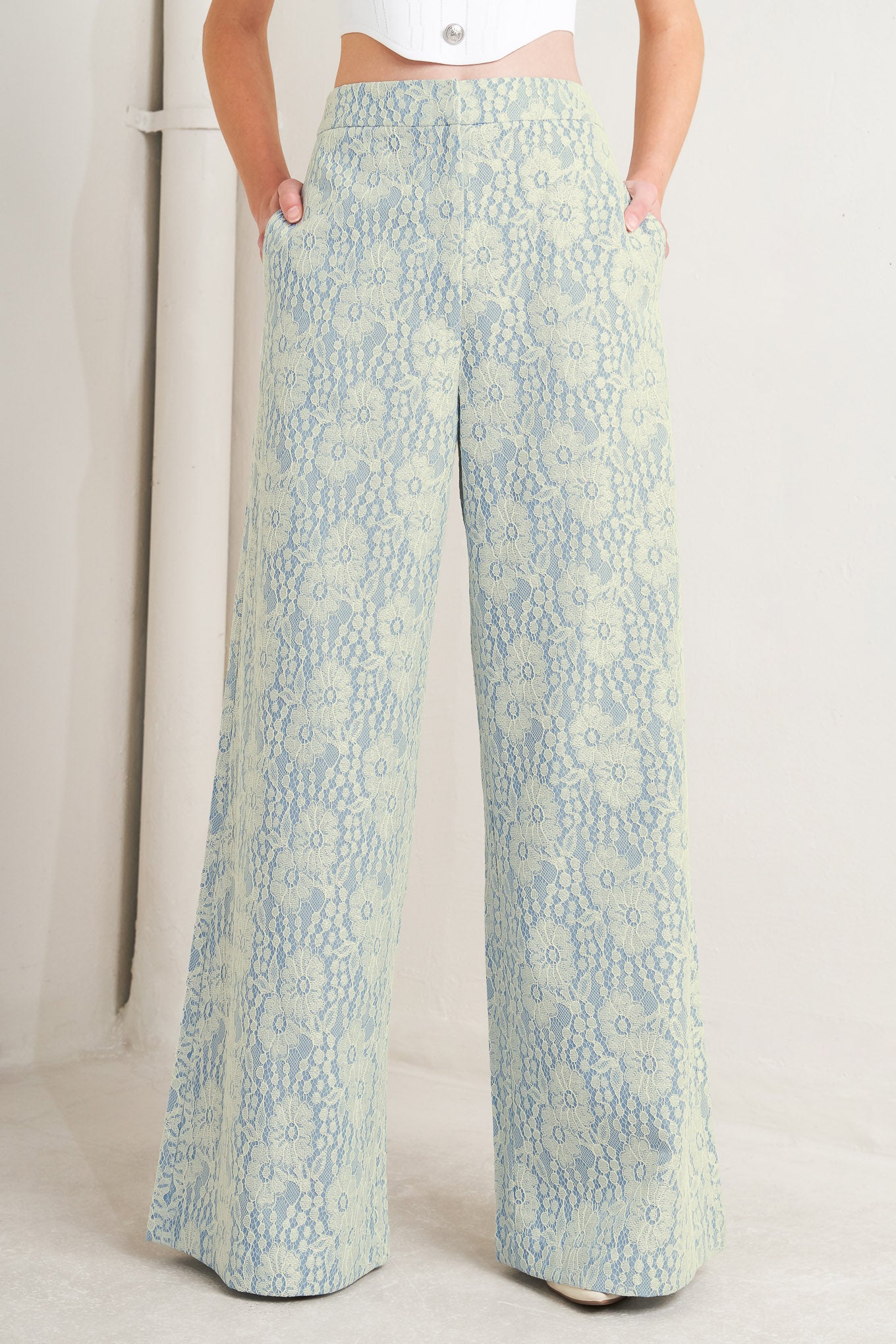 A woven bonded lace pant featuring side zipper closure and wide leg. 

Details: 

Self: 50% Rayon 50% Polyester

Size & Fit

-Model is 5`8" And Wearing Size Small
-Measurements Taken From Size Small
-Approx. Length: 44"