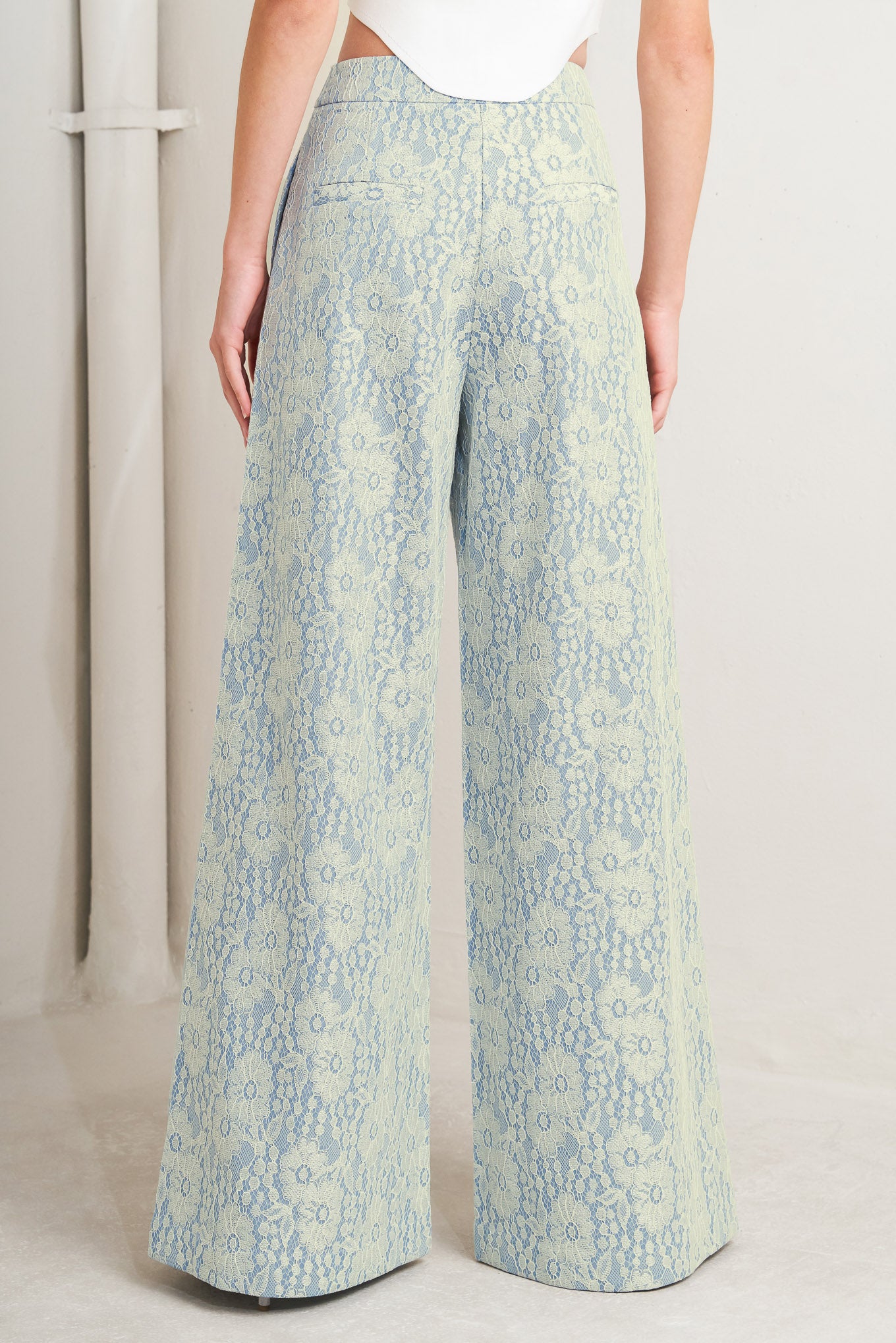 A woven bonded lace pant featuring side zipper closure and wide leg. 

Details: 

Self: 50% Rayon 50% Polyester

Size & Fit

-Model is 5`8" And Wearing Size Small
-Measurements Taken From Size Small
-Approx. Length: 44"