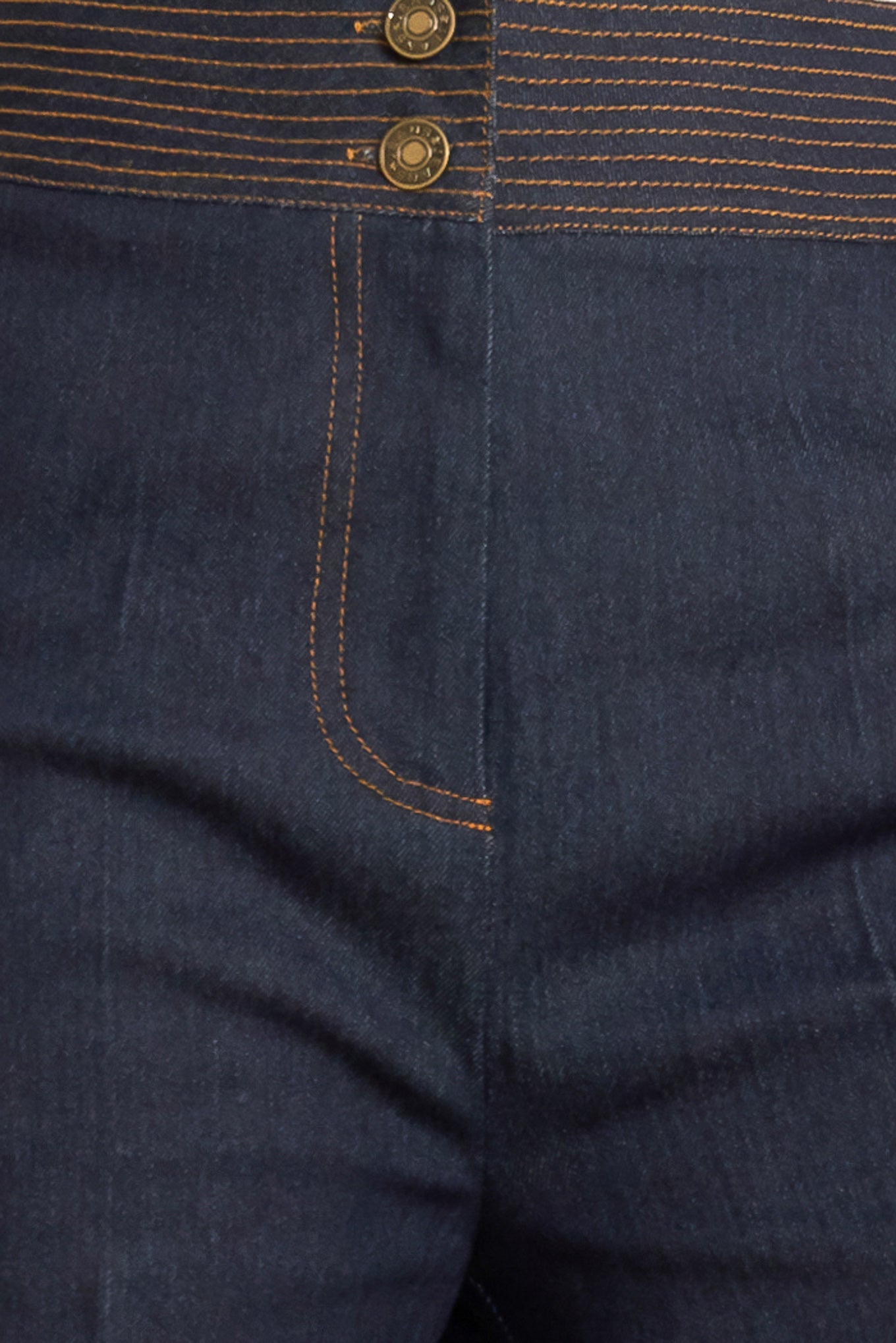 A denim pant featuring front closure, wide waistband with stitching detail, side pocket and wide leg.