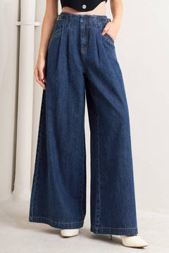 A denim pant featuring front closure, side buckle detail, pockets and wide leg.