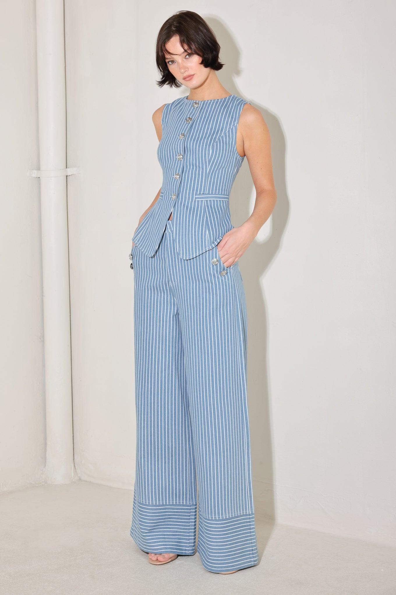 
A striped woven pant featuring front closure, side pockets with buttons and wide leg. Matching vest FJ1360B

Details:

Self : 80% Cotton 20% Polyester

Size &amp; Fit

- Model is 5`8" And Wearing Size Small
- Measurements Taken From Size Small
- Approx. Length: 44"