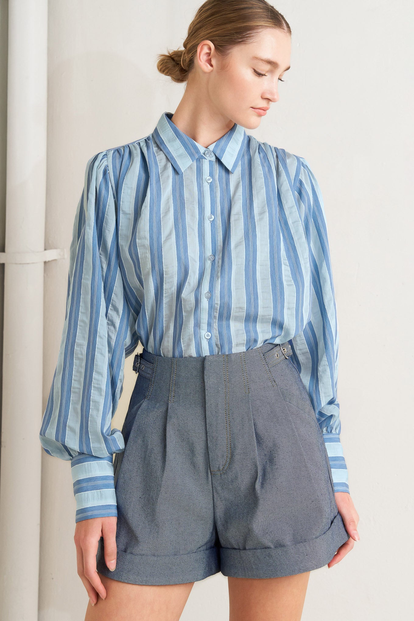 A woven short featuring side tab, front closure, pockets and cuffed hem

Details:

Self : 90% Cotton 10% Polyester

Size & Fit

- Model is 5`8" And Wearing Size Small
- Measurements Taken From Size Small
- Approx. Length: 16"