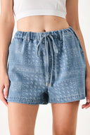 Woman wearing blue bandana-patterned shorts with elastic waist, tie and side pockets | FREEMARKET | Flying Tomato