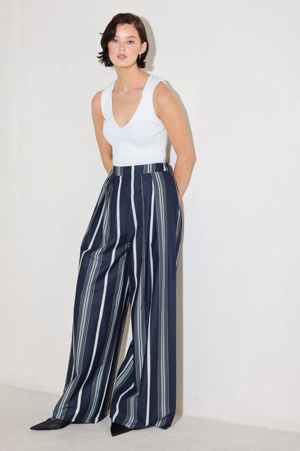 
A striped woven pant featuring front pleat, wide leg and elasticized back waistband. Matching top FT1821B

Details:

Self : 100% Cotton

Size &amp; Fit

- Model is 5`8" And Wearing Size Small
- Measurements Taken From Size Small
- Approx. Length: 44"