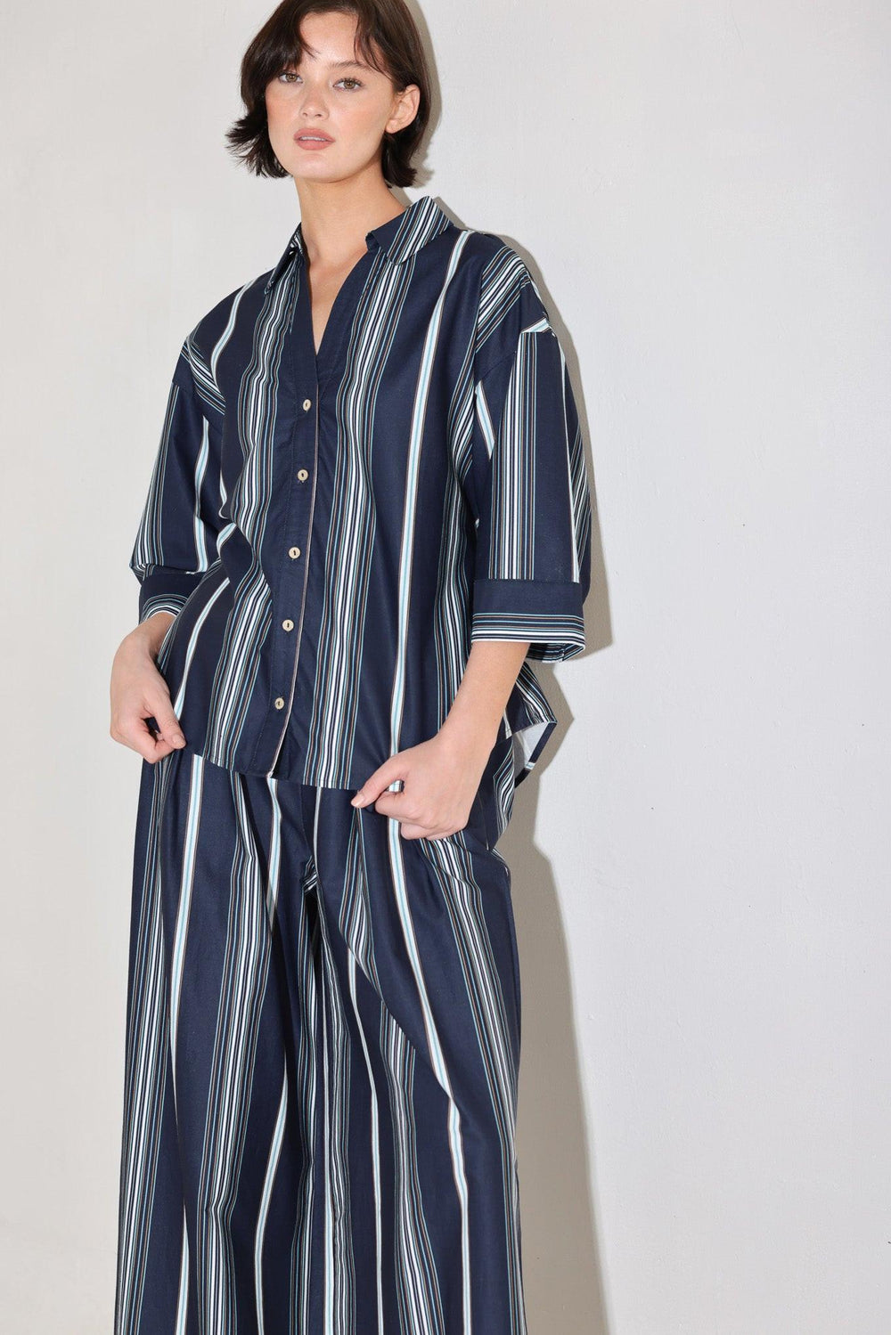 
A striped woven pant featuring front pleat, wide leg and elasticized back waistband. Matching top FT1821B

Details:

Self : 100% Cotton

Size &amp; Fit

- Model is 5`8" And Wearing Size Small
- Measurements Taken From Size Small
- Approx. Length: 44"