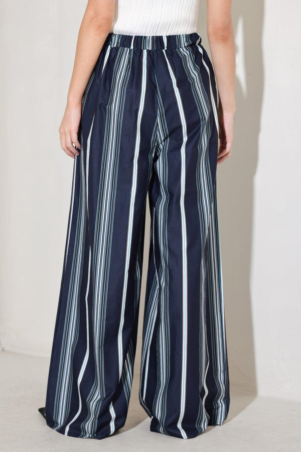 
A striped woven pant featuring front pleat, wide leg and elasticized back waistband. Matching top FT1821B

Details:

Self : 100% Cotton

Size &amp; Fit

- Model is 5`8" And Wearing Size Small
- Measurements Taken From Size Small
- Approx. Length: 44"