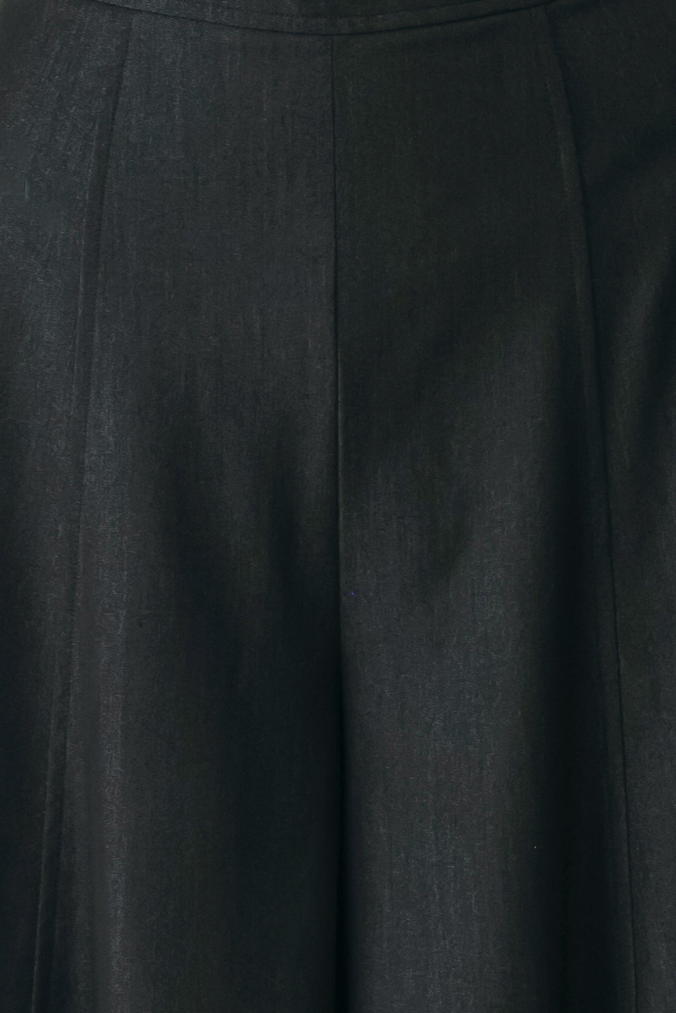 A model wearing high-waisted, wide-leg black trousers | FREEMARKET