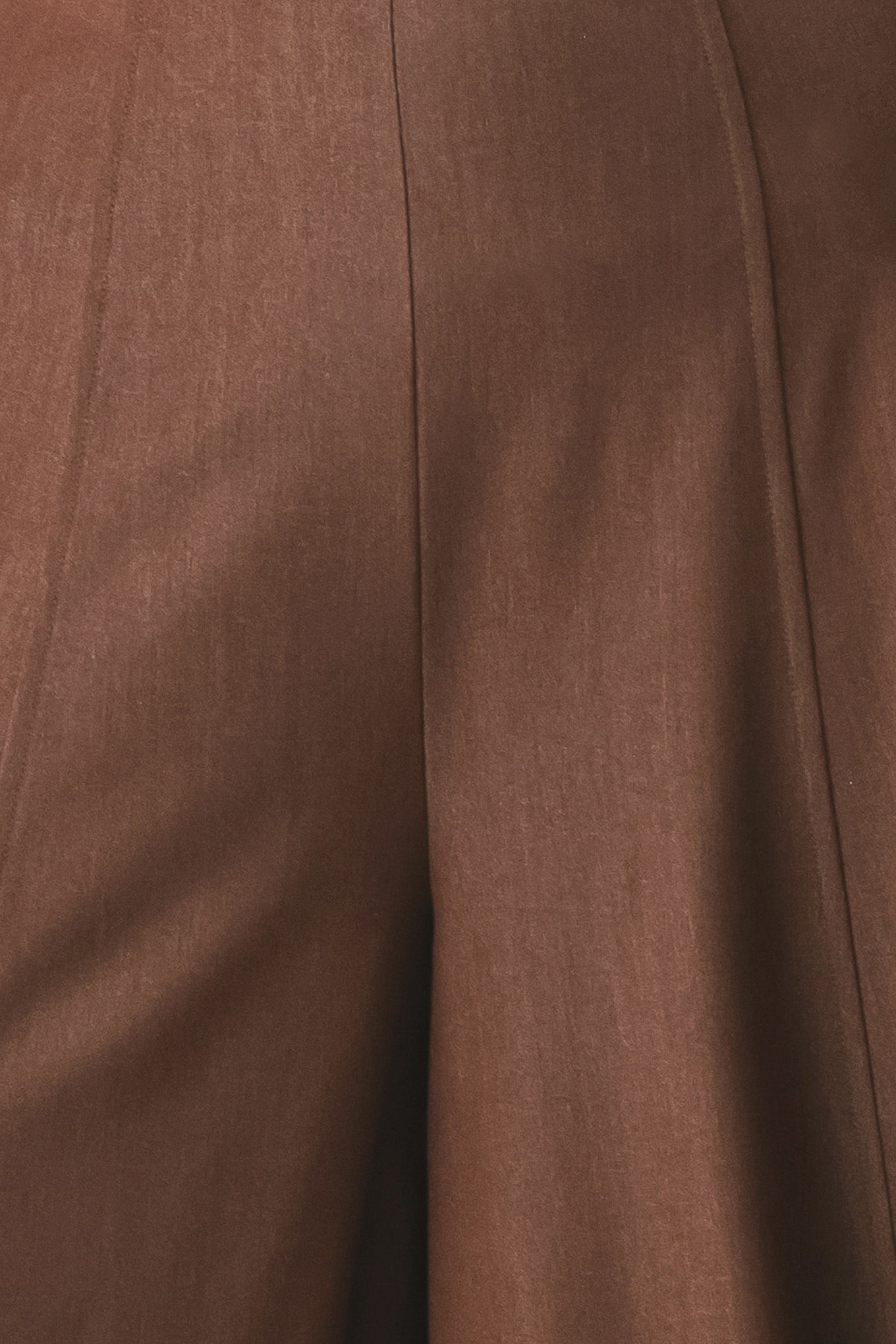 A model wearing high-waisted, wide-leg brown trousers | FREEMARKET