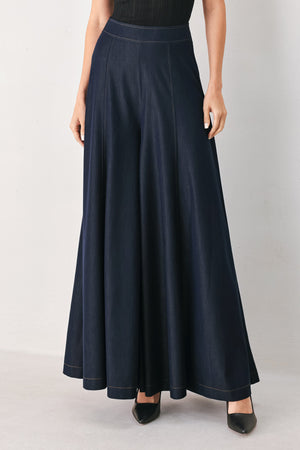 A model wearing high-waisted, wide-leg dark navy blue trousers | FREEMARKET