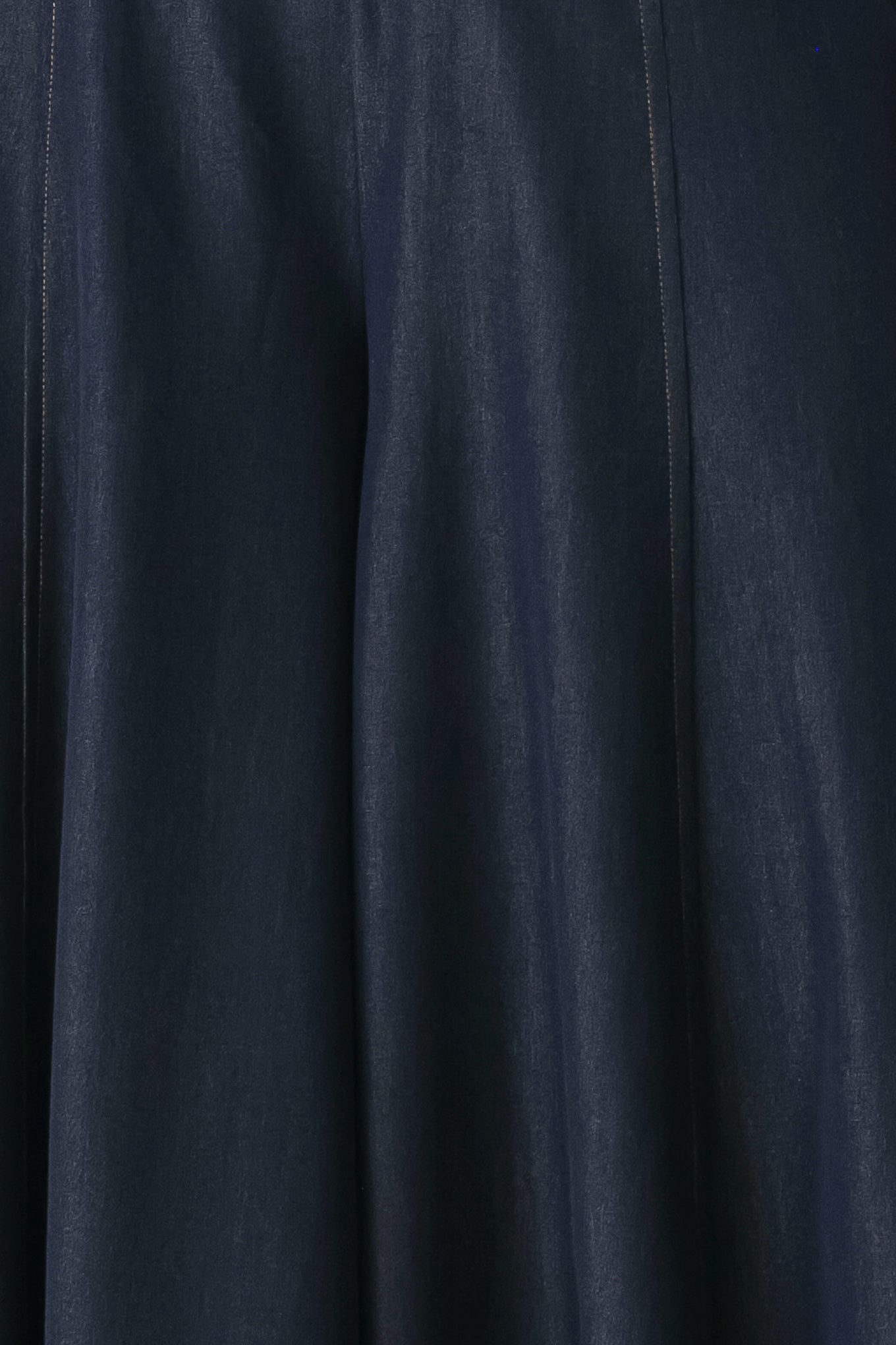 A model wearing high-waisted, wide-leg dark navy blue trousers | FREEMARKET