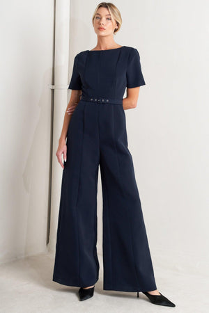 
A solid woven jumpsuit featuring wide neckline, short sleeve, self belt, wide leg, V back and zipper closure

Self : 95% Polyester 5% Spandex

Size &amp; Fit

- Model is 5`8" And Wearing Size Small
- Measurements Taken From Size Small
- Approx. Length: 60"