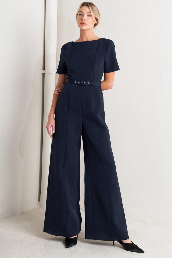 
A solid woven jumpsuit featuring wide neckline, short sleeve, self belt, wide leg, V back and zipper closure

Self : 95% Polyester 5% Spandex

Size &amp; Fit

- Model is 5`8" And Wearing Size Small
- Measurements Taken From Size Small
- Approx. Length: 60"