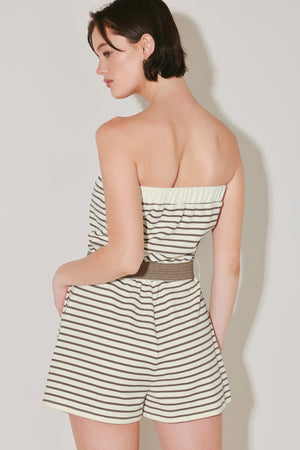 Woman wearing a strapless striped knit romper featuring strapless with elastic opening, elastic waist, side pocket and contrasting belt | FREEMARKET | Flying Tomato