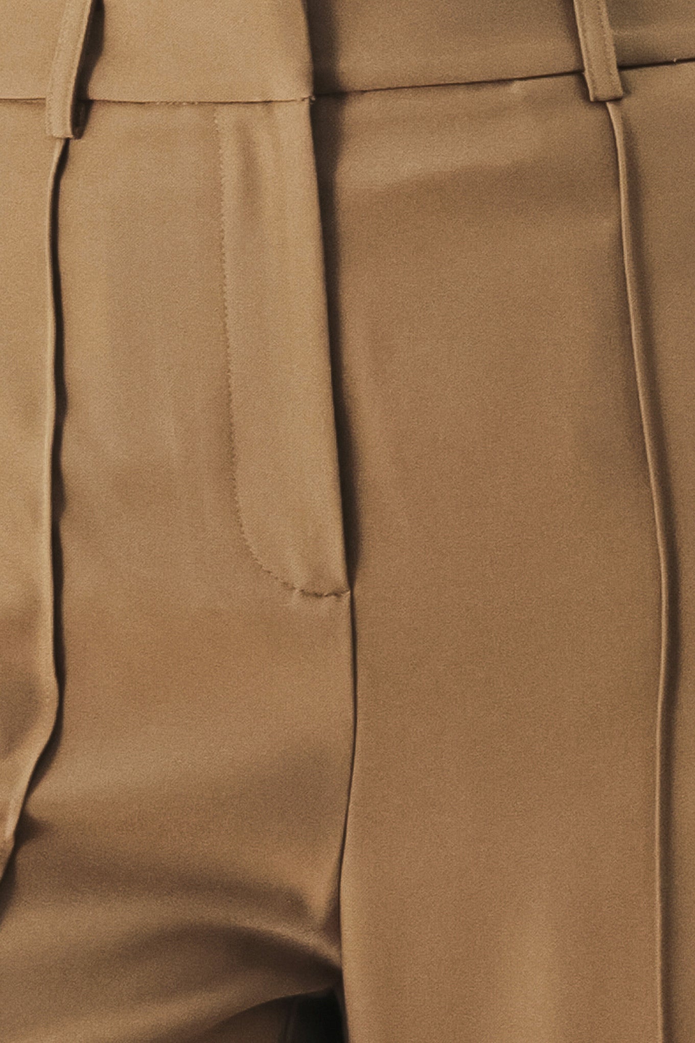 A solid woven pant with front closure and wide leg.