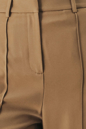 A solid woven pant with front closure and wide leg.