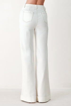 Woman wearing white wide-leg pants with a seam down the middle of each leg | FREEMARKET