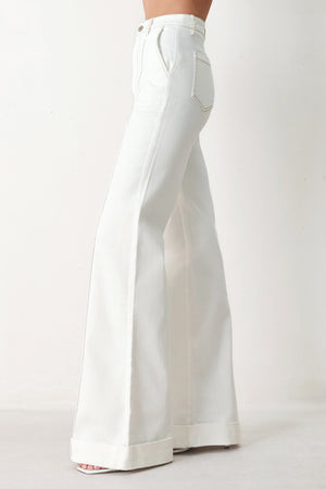 Woman wearing white wide-leg pants with a seam down the middle of each leg | FREEMARKET