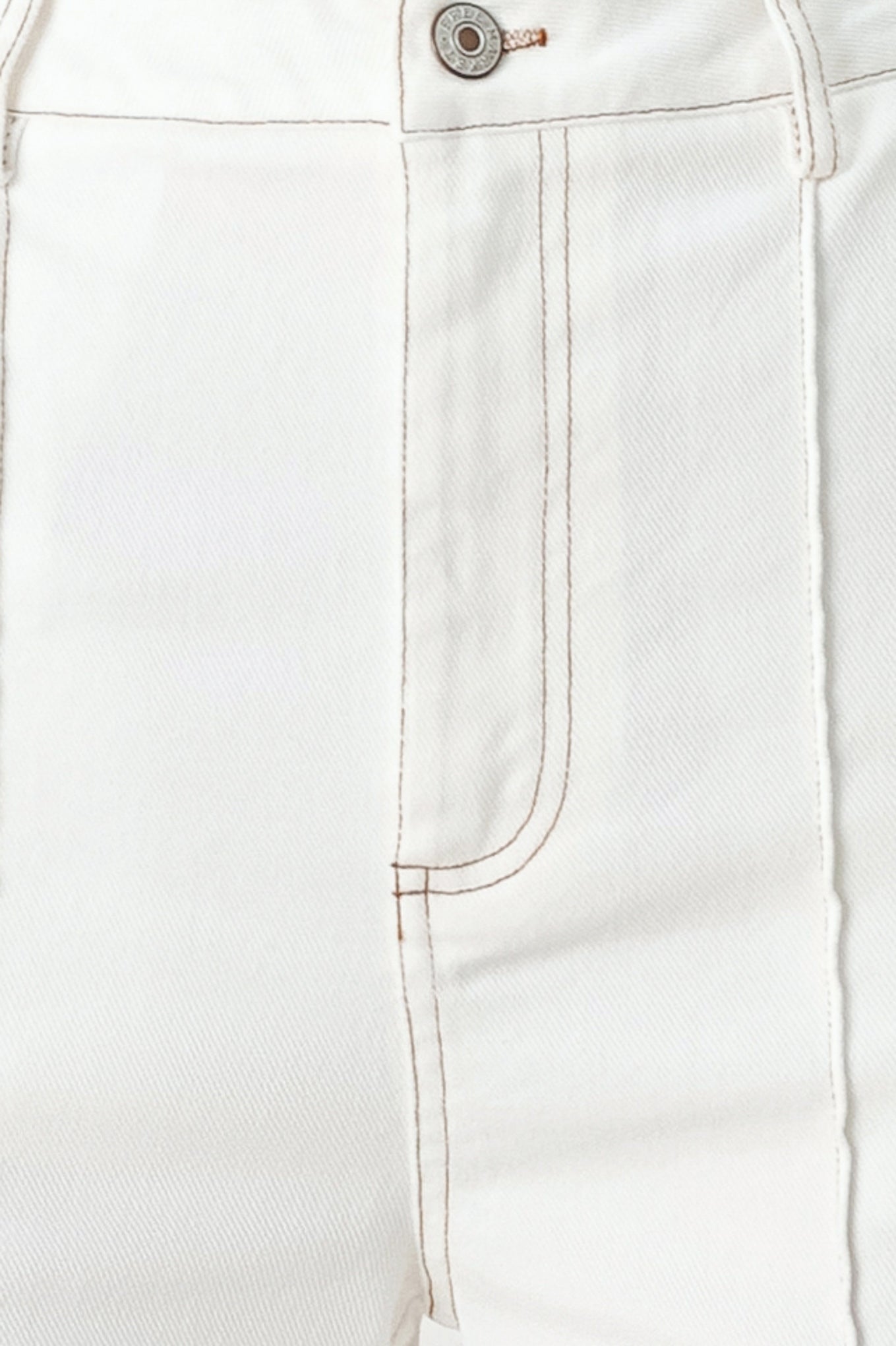 Woman wearing white wide-leg pants with a seam down the middle of each leg | FREEMARKET