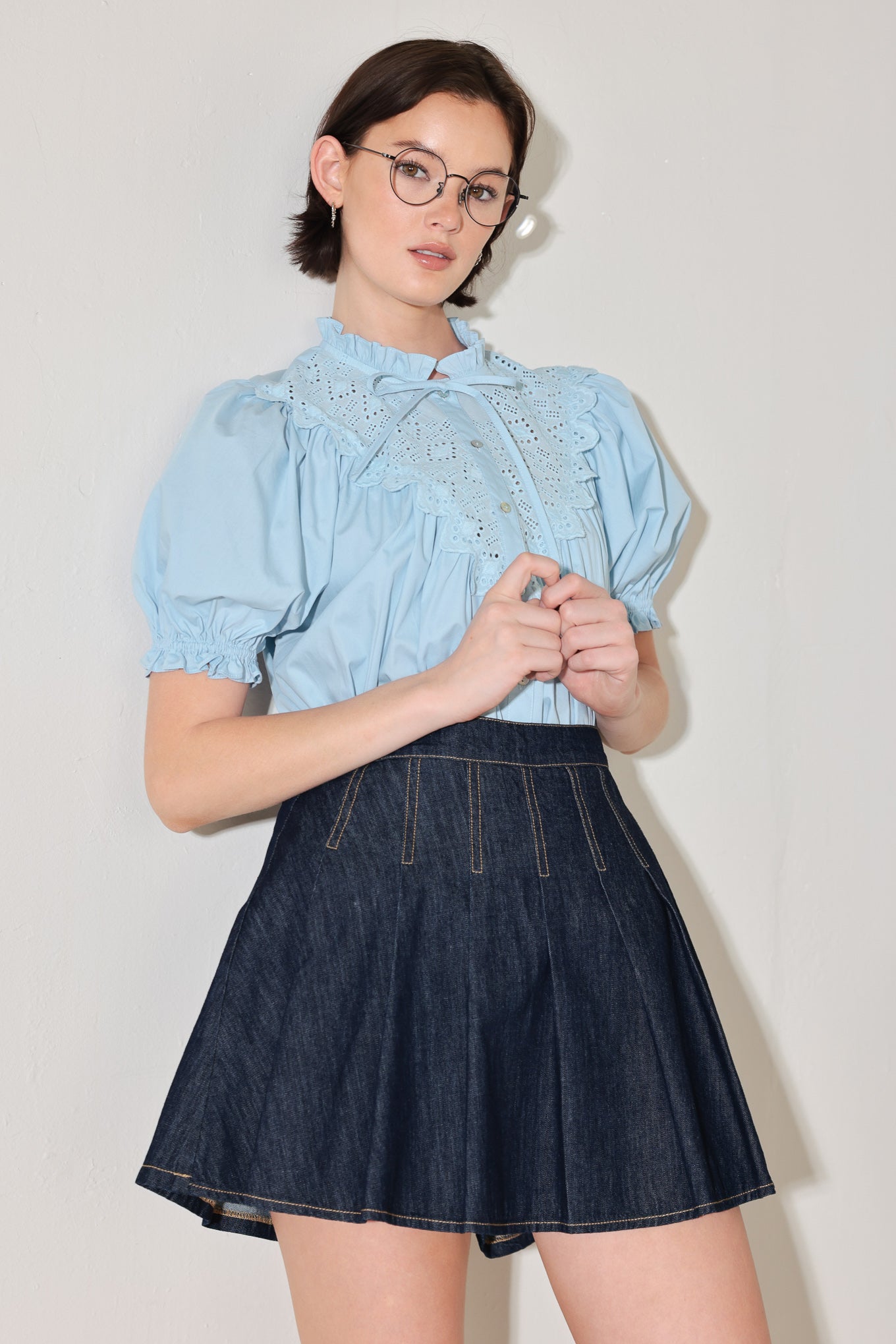 
A denim skort with knife pleats and back zipper closure

Details:

Self : 100% Cotton

Size &amp; Fit

- Model is 5`8" And Wearing Size Small
- Measurements Taken From Size Small
- Approx. Length: 17"