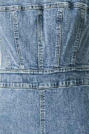Close up of a denim jumpsuit featuring straight neckline, straps, wide leg and back zipper closure | FREEMARKET