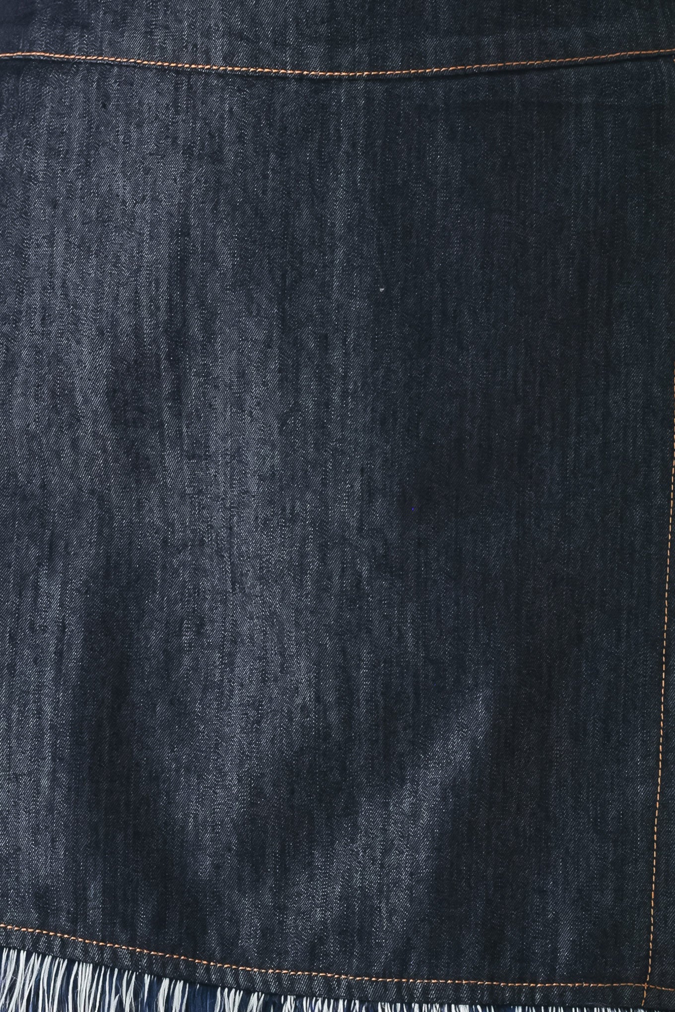 Close up of a dark denim skort featuring front flap, fray edge and back zipper closure | FREEMARKET