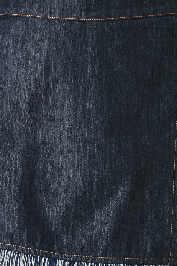 Close up of a dark denim skort featuring front flap, fray edge and back zipper closure | FREEMARKET